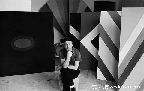 The artist Kenneth Noland in his studio surrounded by his geometric paintings, 1960s.